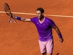 Spain's Rafael Nadal waves to supporters after winning Spain's Carlos Alcaraz at Madrid Open