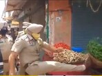 SHO Navdeep Singh seen kicking a vegetable vendors' basket. (brarkhushh/Twitter)