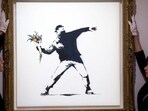Sotheby's to accept bitcoin, ethereum for Banksy's 'Love is in the Air' artwork(Twitter/SPORTSCIRCUSINT)