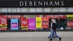 Signs in the window of a closing Debenhams store offer sales bargains on the High Street in Winchester, south west England on March 31, 2021. (AFP) Signs in the window of a closing Debenhams store offer sales bargains on the High Street in Winchester, south west England on March 31, 2021. (AFP)