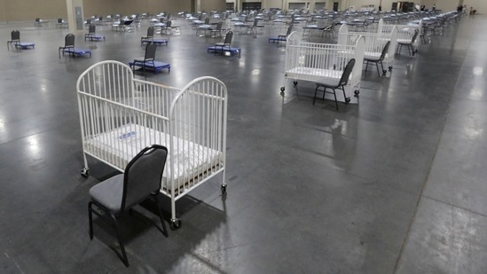 Cots and cribs are arranged at the Mountain America Expo Center in Sandy, Utah, as an alternate care site or for hospital overflow amid the Covid-19 pandemic. (AP) Cots and cribs are arranged at the Mountain America Expo Center in Sandy, Utah, as an alternate care site or for hospital overflow amid the Covid-19 pandemic. (AP)