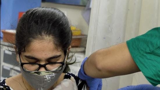 A beneficiary gets inoculated with a dose of vaccine against Covid-19 at Nair Hospital in Mumbai, India, on Wednesday. (HT PHOTO) A beneficiary gets inoculated with a dose of vaccine against Covid-19 at Nair Hospital in Mumbai, India, on Wednesday. (HT PHOTO)