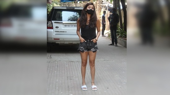 Daisy was seen donning a basic black ganji which she teamed with a pair of matching mini distressed denim shorts.  (Varinder Chawla)