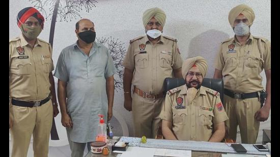 The accused trader in the custody of Sudhar police in Ludhiana on Wednesday. (HT Photo)