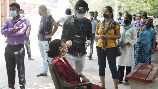 A health worker collects a sample for Covid-19 test at a testing lab,amid a countrywide surge in coronavirus, in Gurugram (PTI Photo) A health worker collects a sample for Covid-19 test at a testing lab,amid a countrywide surge in coronavirus, in Gurugram (PTI Photo)