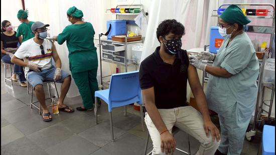 Medics inoculate people with Covid-19 vaccine to people during the third phase of the vaccination drive, at BKC Jumbo Covid Centre in Mumbai. (File photo) Medics inoculate people with Covid-19 vaccine to people during the third phase of the vaccination drive, at BKC Jumbo Covid Centre in Mumbai. (File photo)