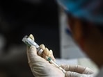 A health worker prepares a dose of the Covid-19 vaccine during the third phase of vaccination at a school in Chhatarpur, New Delhi, India, on Wednesday.(HT PHOTO) A health worker prepares a dose of the Covid-19 vaccine during the third phase of vaccination at a school in Chhatarpur, New Delhi, India, on Wednesday.(HT PHOTO)