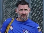 CSK batting coach Mike Hussey (L), Bowling coach L Balaji (R)