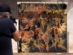 Israeli ex-sniper creates artwork using gun on canvas instead of paint brushes(Twitter/JComm_NewsFeeds) Israeli ex-sniper creates artwork using gun on canvas instead of paint brushes(Twitter/JComm_NewsFeeds)