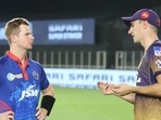 Steve Smith (L) and Pat Cummins have a word. 