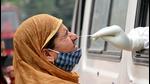 Jammu & Kashmir, May 06 (ANI): A health worker collects swab samples from a woman for rapid antigen COVID-19 test, in the Mobile Testing Facility at Poonch on Thursday. (ANI Photo) (ANI) Jammu & Kashmir, May 06 (ANI): A health worker collects swab samples from a woman for rapid antigen COVID-19 test, in the Mobile Testing Facility at Poonch on Thursday. (ANI Photo) (ANI)