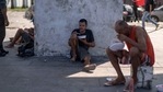 Homeless men eat a meal given to them by the project Covid Sem Fome (Covid Without Hunger) at the internationally renowned tourist attraction of the Lapa Arches, in downtown Rio de Janeiro, Brazil, on May 05, 2021. (AFP) Homeless men eat a meal given to them by the project Covid Sem Fome (Covid Without Hunger) at the internationally renowned tourist attraction of the Lapa Arches, in downtown Rio de Janeiro, Brazil, on May 05, 2021. (AFP)