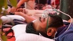 A Covid-19 coronavirus patient breathes with the help of oxygen provided by a Gurdwara, a place of worship for Sikhs, under a tent installed along the roadside in Ghaziabad. (AFP) A Covid-19 coronavirus patient breathes with the help of oxygen provided by a Gurdwara, a place of worship for Sikhs, under a tent installed along the roadside in Ghaziabad. (AFP)