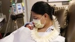 Lavinia "Lavi" Mounga holds her son Raymond Mounga at Kapiolani Medical Center for Women & Children in Honolulu.(AP) Lavinia "Lavi" Mounga holds her son Raymond Mounga at Kapiolani Medical Center for Women & Children in Honolulu.(AP)