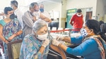 A medic administers COVID-19 vaccine to an eldery citizen during a vaccination drive in Gurugram on Thursday. (PTI) A medic administers COVID-19 vaccine to an eldery citizen during a vaccination drive in Gurugram on Thursday. (PTI)