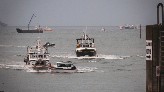 French fishing vessels at sea off the coast of Jersey, Thursday, May 6, 2021. (AP) French fishing vessels at sea off the coast of Jersey, Thursday, May 6, 2021. (AP)
