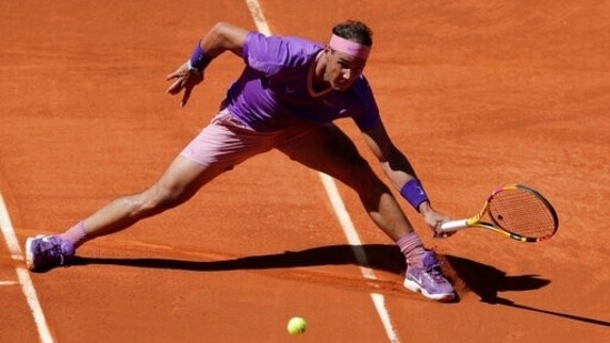 Rafael Nadal of Spain returns the ball to Alexei Popyrin of Australia during their match at the Madrid Open tennis tournament in Madrid(AP)