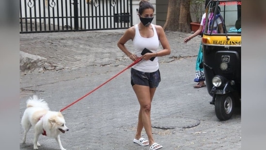 For her outing, the actor wore a white halter-neck top which she teamed with a pair of mini shorts.(Varinder Chawla)