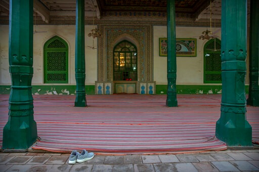 A pair of shoes sits near an outdoor prayer area at the Id Kah Mosque in Kashgar in western China's Xinjiang Uyghur Autonomous Region, as seen during a government organized visit for foreign journalists on April 19, 2021. (AP) A pair of shoes sits near an outdoor prayer area at the Id Kah Mosque in Kashgar in western China's Xinjiang Uyghur Autonomous Region, as seen during a government organized visit for foreign journalists on April 19, 2021. (AP)