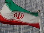 An Iranian flag flutters in front of the International Atomic Energy Agency (IAEA) headquarters in Vienna, Austria.