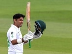 FILE PHOTO: Pakistan's Abid Ali celebrates his half-century, as play resumes behind closed doors following the outbreak of the coronavirus disease.