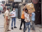 While 96 oxygen concentrators were seized from Khan Chacha, another nine were found illegally stored at Town Hall. In picture - Police personnel in a raid at Khan Chacha restaurant in New Delhi.(PTI) While 96 oxygen concentrators were seized from Khan Chacha, another nine were found illegally stored at Town Hall. In picture - Police personnel in a raid at Khan Chacha restaurant in New Delhi.(PTI)