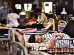 Patients at the Covid-19 care facility attached to Lok Nayak Hospital, at Shehnai Banquet in New Delhi, on Friday. Delhi had over 91,000 active Covid cases as on Friday. Patients at the Covid-19 care facility attached to Lok Nayak Hospital, at Shehnai Banquet in New Delhi, on Friday. Delhi had over 91,000 active Covid cases as on Friday.