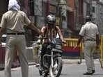 Kerala recorded 42,464 new infections on Thursday, the highest since the outbreak hit the state last year. In picture - Police and commuters during a weekend lockdown in Kerala. 