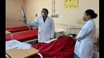 A doctor checking reports at Indira Gandhi Medical College and Hospital in Shimla. (HT file photo) A doctor checking reports at Indira Gandhi Medical College and Hospital in Shimla. (HT file photo)