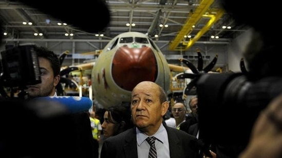 French defence minister Jean-Yves Le Drian visits the A400M assembly line during the A400M First Delivery Ceremony in Sevilla. (AFP Photo)
