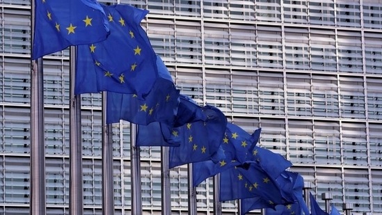 European Union flags fly outside the European Commission headquarters in Brussels, Belgium.(Reuters)