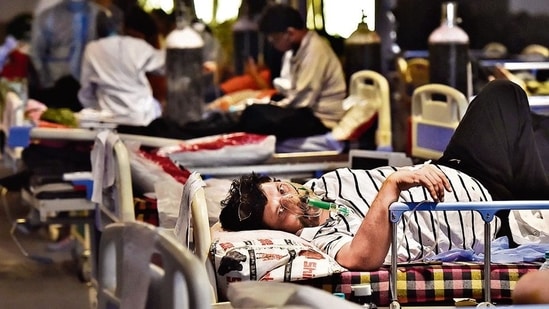 Patients at the Covid-19 care facility attached to Lok Nayak Hospital, at Shehnai Banquet in New Delhi, on Friday. Delhi had over 91,000 active Covid cases as on Friday. (HT Photo ) Patients at the Covid-19 care facility attached to Lok Nayak Hospital, at Shehnai Banquet in New Delhi, on Friday. Delhi had over 91,000 active Covid cases as on Friday. (HT Photo )
