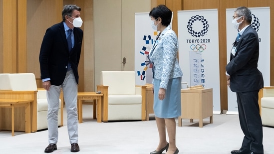 Sebastian Coe, left, the president of World Athletics, an internationally governing organization for the sport of athletics, greets Tokyo Gov. Yuriko Koike before they have a talk in Tokyo on Friday, May 7, 2021. (AP) Sebastian Coe, left, the president of World Athletics, an internationally governing organization for the sport of athletics, greets Tokyo Gov. Yuriko Koike before they have a talk in Tokyo on Friday, May 7, 2021. (AP)