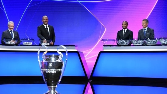 Didier Drogba, Florent Malouda and UEFA General Secretary and Director of Football Giorgio Marchetti during the draw. (REUTERS) Didier Drogba, Florent Malouda and UEFA General Secretary and Director of Football Giorgio Marchetti during the draw. (REUTERS)