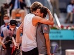 Germany's Alexander Zverev, left, embraces Austria's Dominic Thiem after winning the semi-final match at the Mutua Madrid Open tennis tournament.