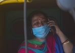 A relative of a person who died of Covid-19 in tears while speaking on the phone outside LNJP hospital in New Delhi. (Amal KS/ Hindustan Times)