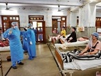 Doctors attend to patients at a Covid ward, in Kanpur on Saturday.
