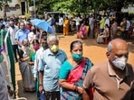 Civilians wait in a queue to get vaccinated against coronavirus in Chikmagalur. Civilians wait in a queue to get vaccinated against coronavirus in Chikmagalur.