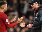 Roberto Firmino (left) and Jurgen Klopp of Liverpool. 