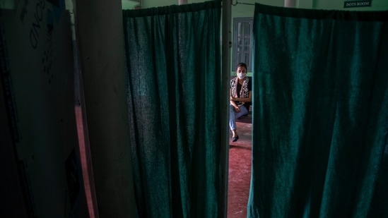 A young woman waits to get tested for COVID-19 at a government run hospital in Gauhati, India, Saturday, May 8, 2021. (Representational)(AP)
