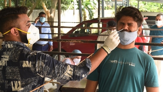 A man's sample is being taken for a test. (HT Photo) A man's sample is being taken for a test. (HT Photo)