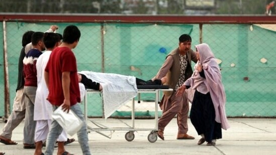 An injured school student is transported to a hospital after a bomb explosion near a school west of Kabul, Afghanistan.(AP)