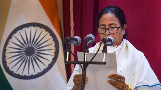 Kolkata: TMC Supremo Mamata Banerjee takes oath as the Chief Minister of West Bengal for the third time consecutively during her Swearing-in-Ceremony, at Governor House in Kolkata, Wednesday, May 5, 2021. (PTI Photo/Swapan Mahapatra)(PTI05_05_2021_000028B) (PTI)