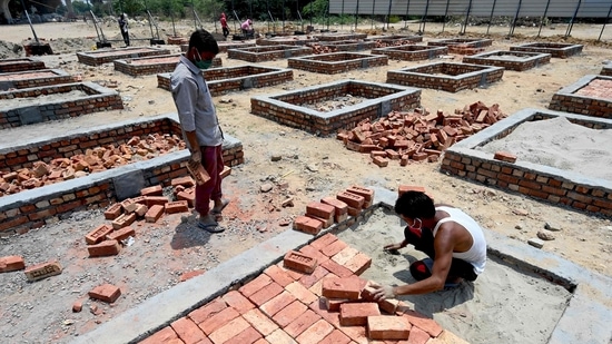 Workers building cremation platforms in an empty lot in New Delhi on May 5. “If you don’t test very much, you’re most likely to miss Covid deaths,” Christopher Murray, director of the Institute for Health Metrics and Evaluation, said in a briefing with journalists.(Money Sharma / AFP)