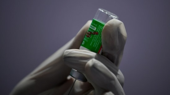 A health worker draws a syringe from a Covishield vial, at BKC Jumbo vaccination centre in Mumbai. (Indranil Mukherjee / AFP) A health worker draws a syringe from a Covishield vial, at BKC Jumbo vaccination centre in Mumbai. (Indranil Mukherjee / AFP)