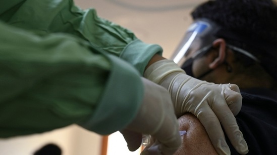 ) In this file photo a medical worker inoculates a man with a dose of the Covishield, AstraZeneca-Oxford's Covid-19 coronavirus vaccine, at Max hospital in New Delhi. (AFP) ) In this file photo a medical worker inoculates a man with a dose of the Covishield, AstraZeneca-Oxford's Covid-19 coronavirus vaccine, at Max hospital in New Delhi. (AFP)