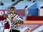 Manchester United's Bruno Fernandes celebrates after scoring his side's opening goal from penalty during the English Premier League soccer match between Aston Villa and Manchester United at Villa Park in Birmingham, England, Sunday, May 9, 2021. (Shaun Botterill/Pool via AP)