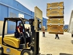 A driver loads the medical supplies, which will be sent to India, at the International Humanitarian City in Dubai on Sunday.(Reuters) A driver loads the medical supplies, which will be sent to India, at the International Humanitarian City in Dubai on Sunday.(Reuters)