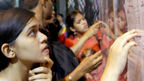 The first cut-off list for degree college admissions have been announced. Students look at the merit list at Dadar's Ruia College. (Representative image)(HT File) The first cut-off list for degree college admissions have been announced. Students look at the merit list at Dadar's Ruia College. (Representative image)(HT File)