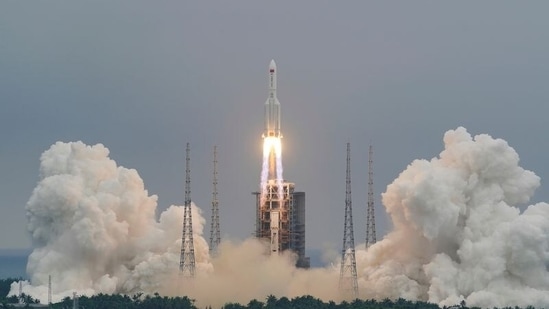 FILE PHOTO: The Long March-5B Y2 rocket, carrying the core module of China's space station Tianhe, takes off from Wenchang Space Launch Center in Hainan province, China April 29, 2021. China Daily via REUTERS